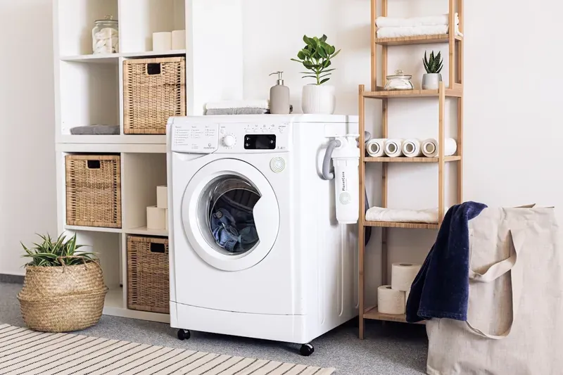 Washing Machine repair technician at work